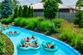 people on floats in a backyard lazy river