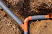 drainage trench with plastic pipes