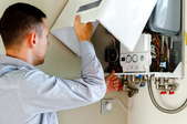 person repairing boiler device