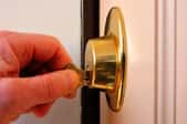 hand locking or unlocking lock with a key