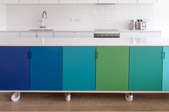 row of blue and green cabinets