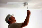 Painting a textured ceiling.