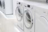 row of white washers and dryers