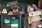 Stacks of junk stored in a garage. 