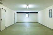 basement with white walls and concrete floor