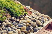 green roof with stones and gutter