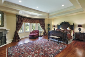 large bedroom with oriental area rug as a central point