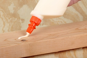 glue being piped out on wood