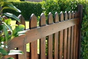 wood fence with hedges