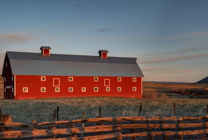 red barn and pasture with fence