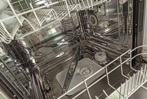 The inside of an empty dishwasher.