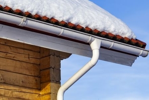 snowy roof with gutter and downspout