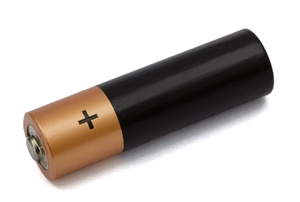 A battery laying on its side with the + showing.