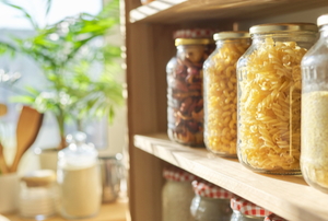 organized pantry with food goods stored in jars