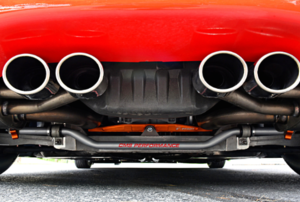 back of a red car with four exhaust pipes
