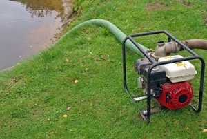 pumping vacuum cleaning a pond