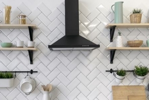 kitchen wall with wooden shelves on either side of a stove
