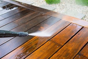 power washer cleaning deck