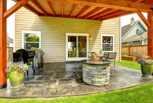 A patio with a fire pit.