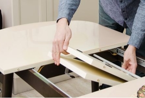 person unfolding collapsable table