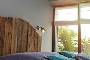 Wooden headboard and sunny window