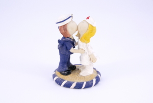 figurine of two people kissing