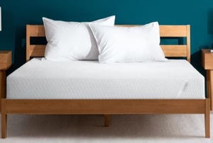 bed in room with teal wall