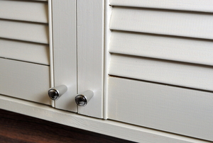white painted louvered (slatted) closet doors