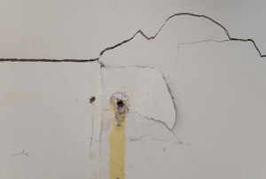 Crack and hole in drywall