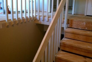 Several unfinished wooden stair treads of a two-story home.