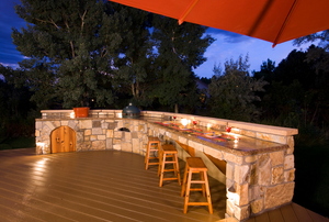 Large outdoor kitchen lit up at night