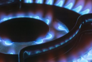 gas burner on a stove lit in the dark