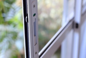 a sliding glass door with a lock mechanism