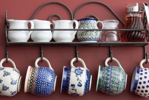 tea cup supplies on a metal wall kitchen rack