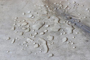 water beaded up on concrete