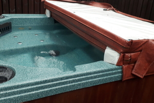hot tub with hard cover half open