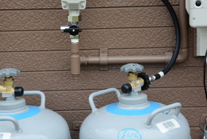propane tanks connected to exterior gas system