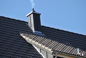 stainless steel chimney on a roof