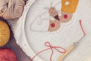 needle point embroidery design with yarn and tool
