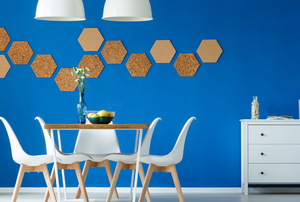 clean dining space with bright blue wall and geometric shapes