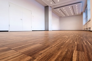 A room with laminate floors.