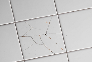 Ugly, cracked ceramic tile.