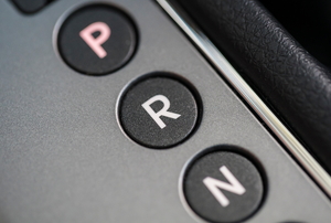 Close-up view of the reverse indicator on a vehicle's gear shift.
