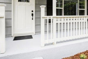 white painted concrete porch with railing