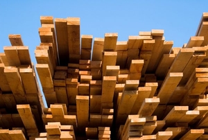 A large stack of wooden planks.
