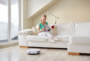 A robotic vacuum cleaner in a living room