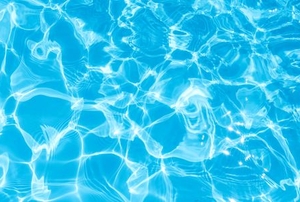 Waves of light ripple through a clean pool.