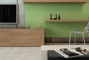 a small, stylish room with wooden tables attached to the wall.