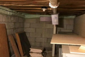 An unfinished basement crawlspace.