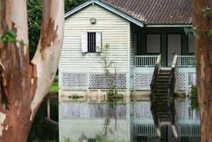 A house with a flooded yard. 